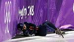 4950174B00000578-5403183-Elise_Christie_of_Great_Britain_falls_after_contact_with_Jinyu_L-a-26_1518869394590.jpg